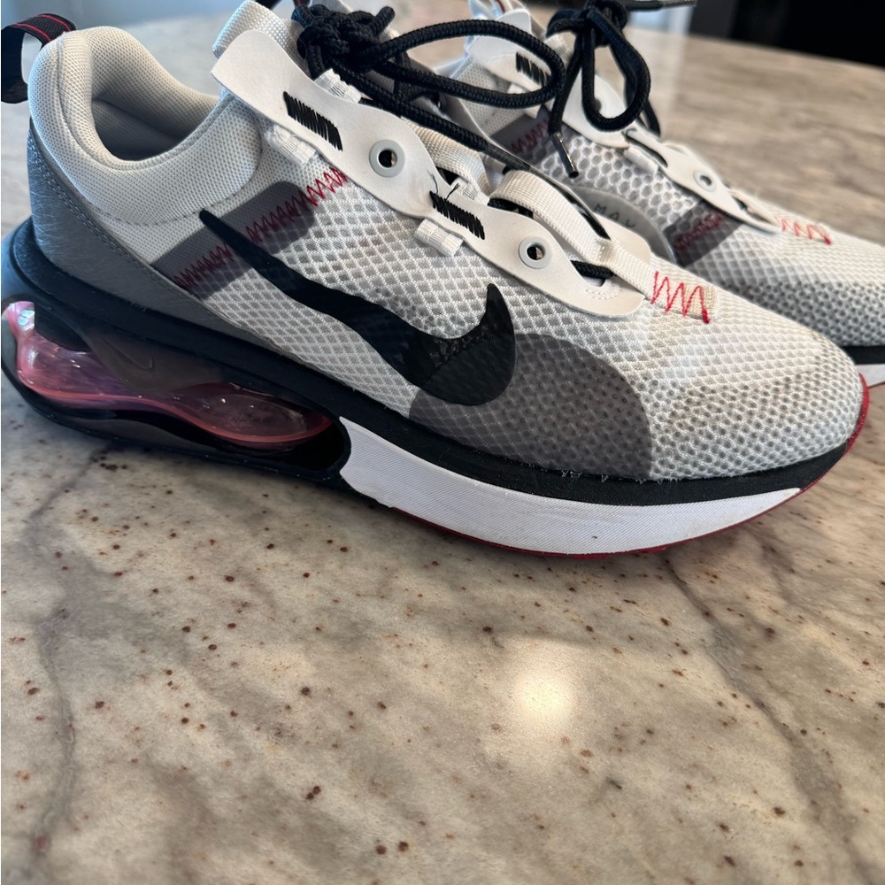 Men’s Nike Air Max. Light gray with dark gray and red accents.